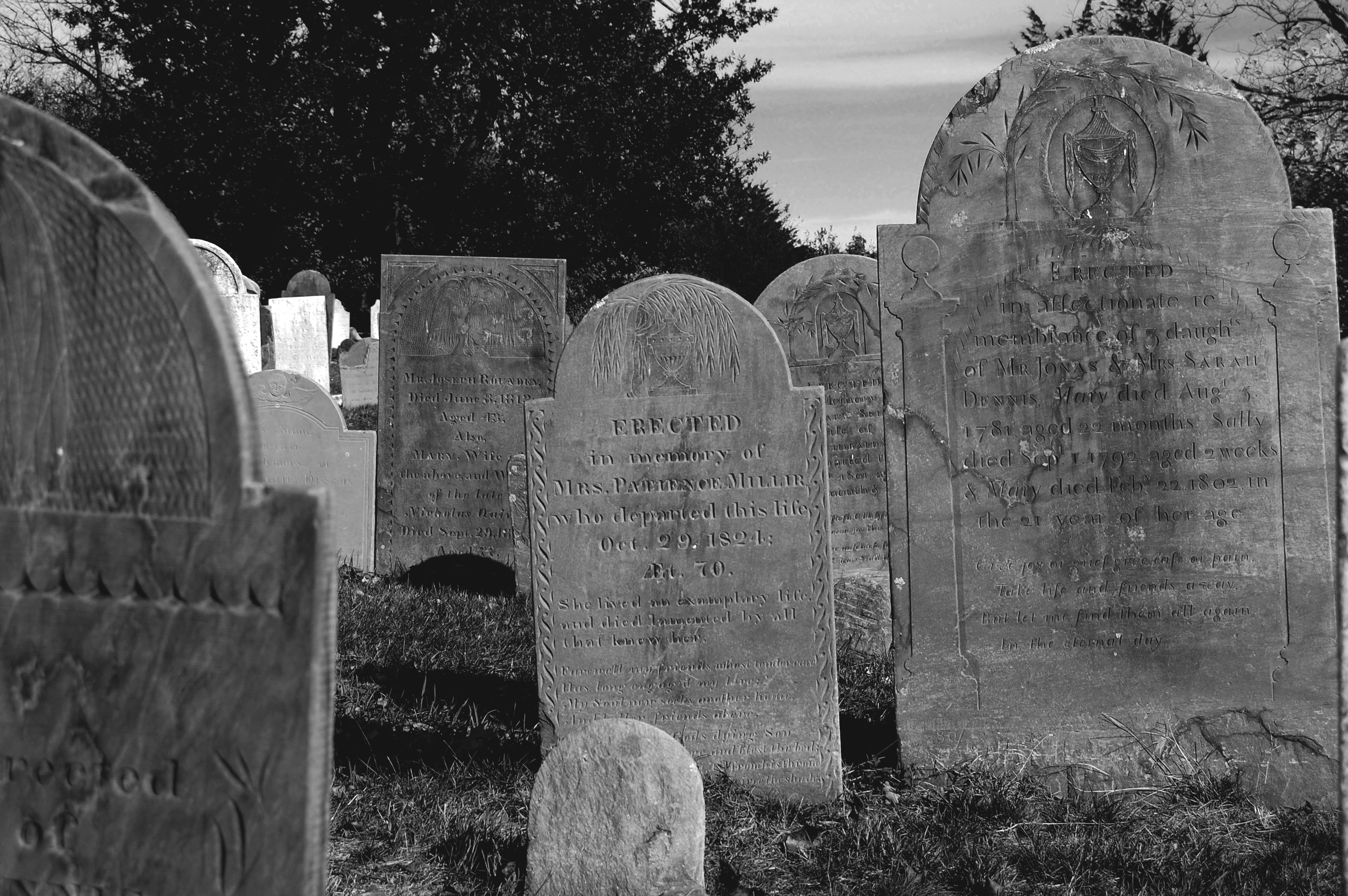 Photo of a historic cemetery with weathered 18th/19th-century headstones